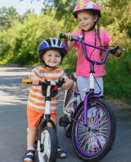 photo of child riding a bicycle